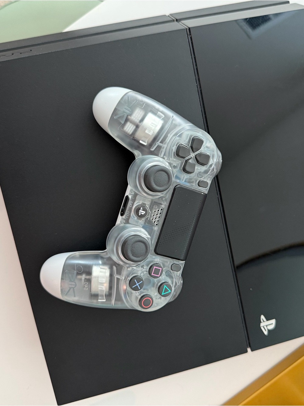 PS4 Sony PlayStation 4 console with transparent DualShock controller